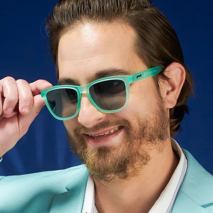 Men's style and fit showcase of mint coloured square-frame sunglasses.