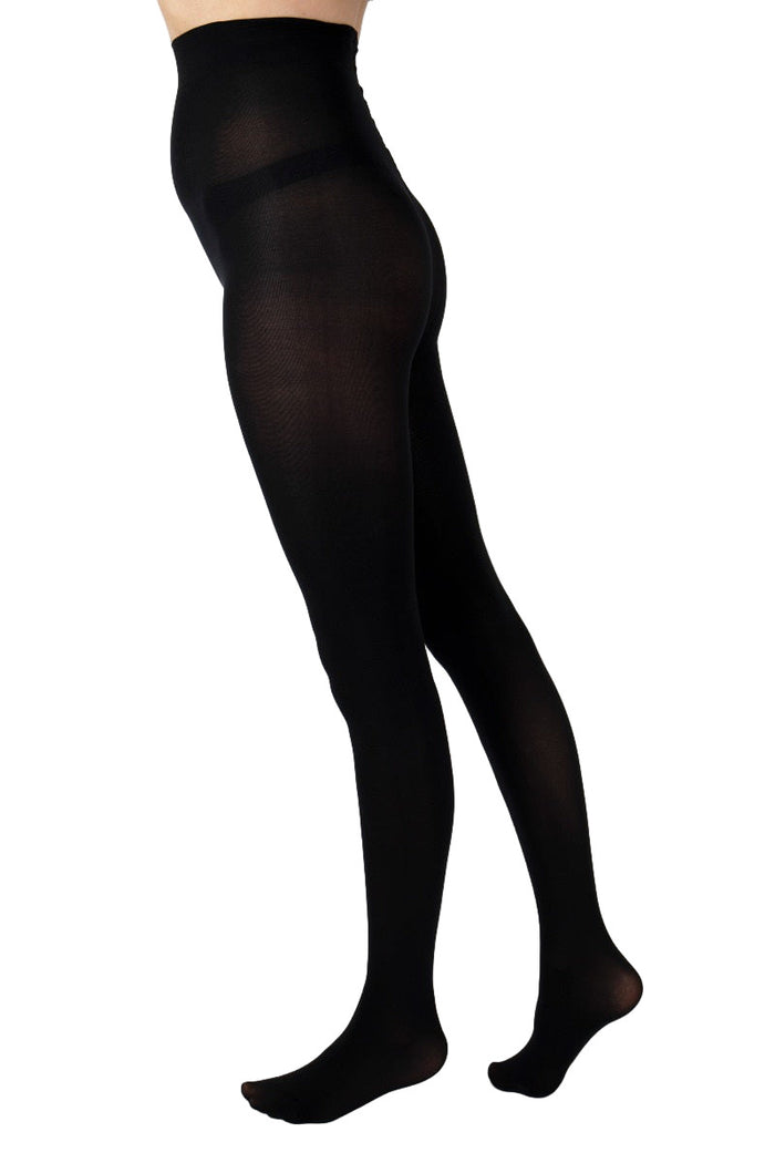 Black 100 denier tights worn by a person on a white background