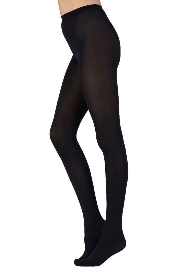 Black tights worn by a person on a white background