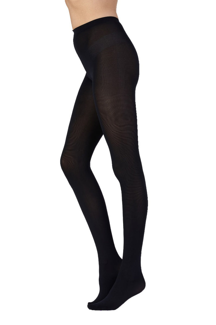 Navy tights worn by a person on a white background
