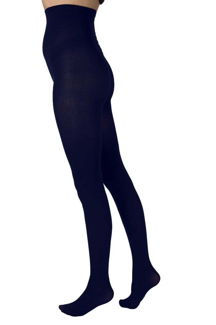 Navy blue tights worn by a person on a white background