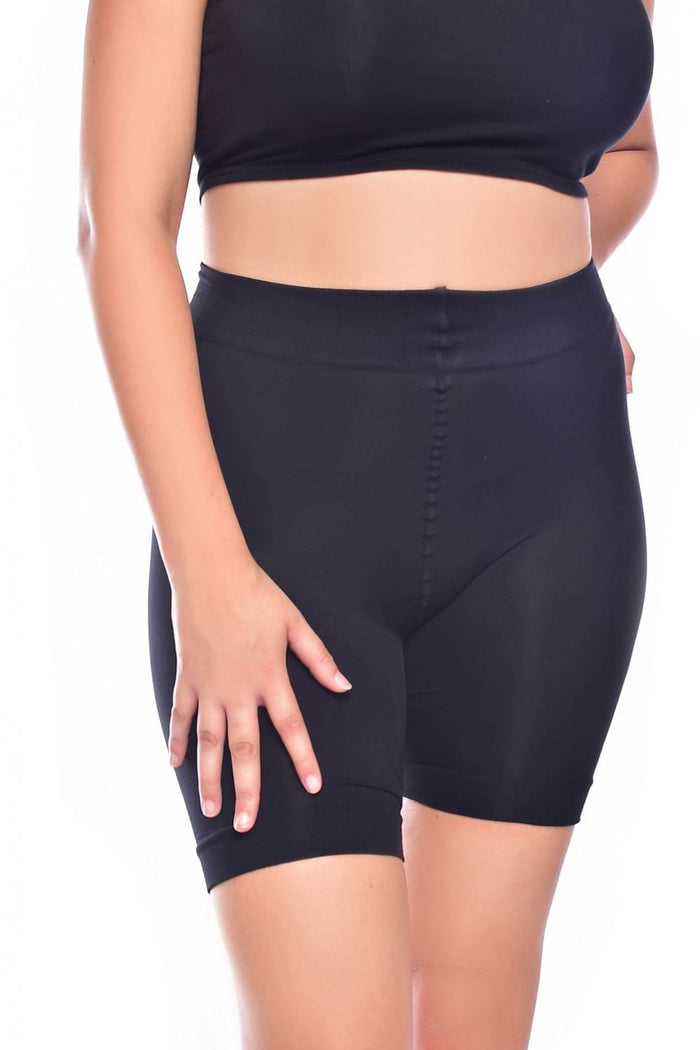 Person wearing blackanti chafing  shorts on a white background
