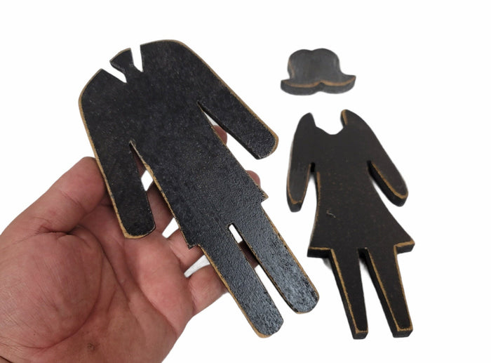 bathroom sign wooden man and woman figures