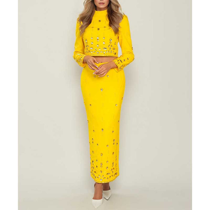 Beaded women's skirt suit in vibrant yellow with long sleeves and elegant design