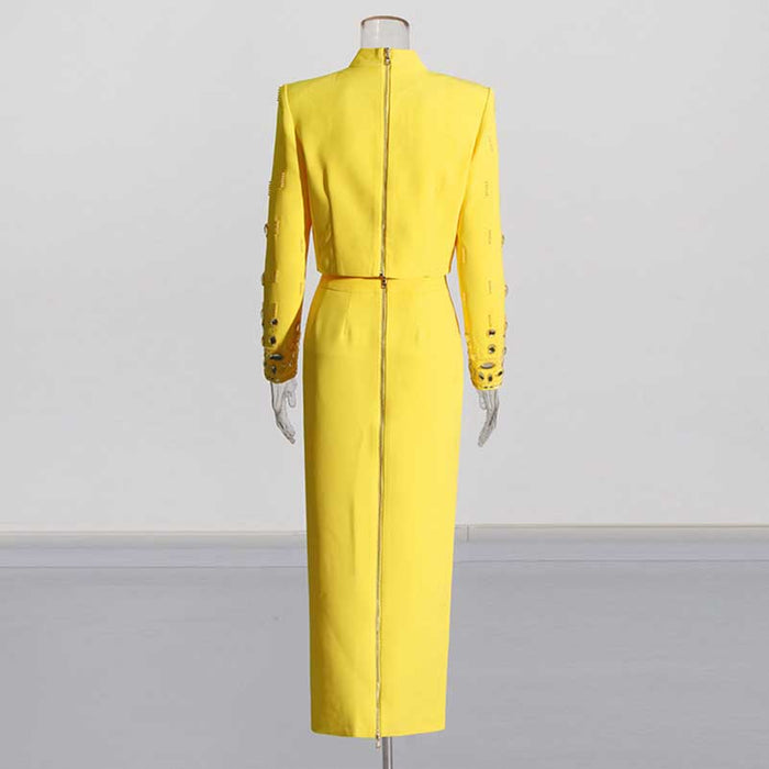 Stylish beaded women's skirt suit in vibrant yellow with long sleeves and a fitted silhouette