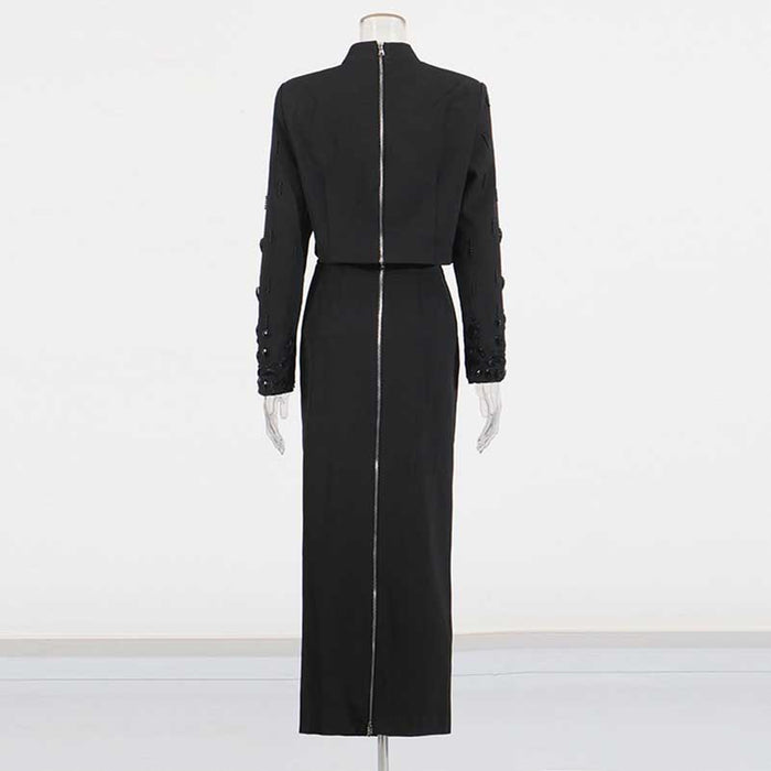 Back view of a beaded women's skirt suit in elegant black with tailored fit and detailed embellishments