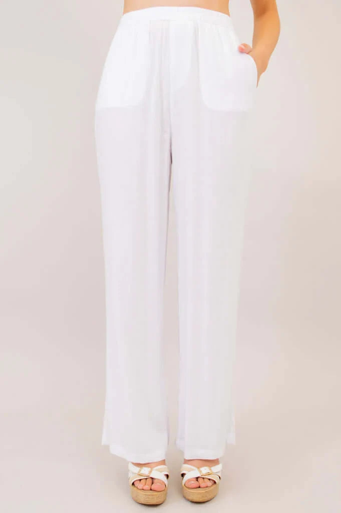 White wide-leg pants worn by a person on a plain background
