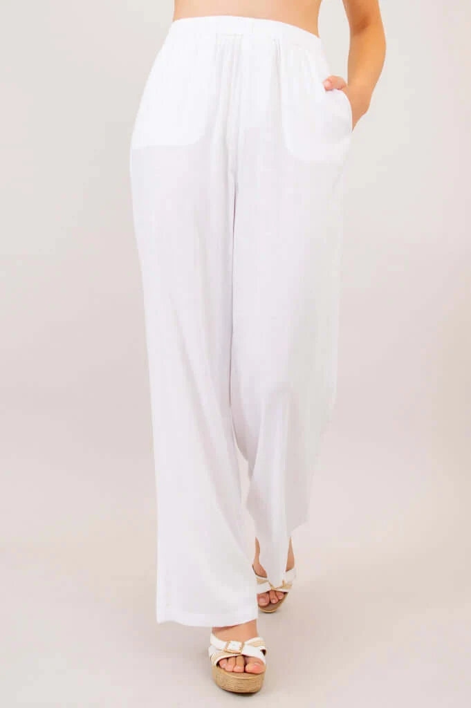 White wide-leg pants worn by a person on a plain background