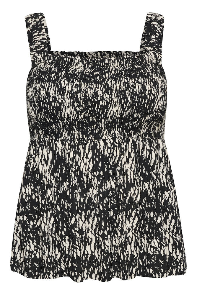 Black and white patterned dress with thin straps on a white background