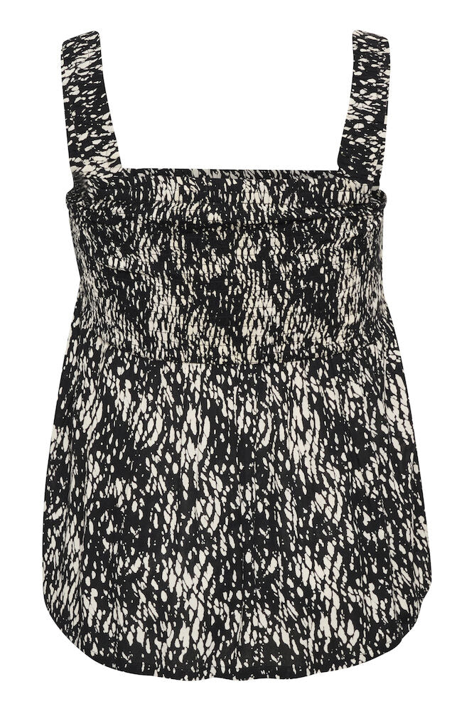 Black and white patterned romper on a white background