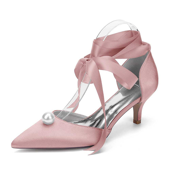 Bridal ankle strap heels with pearls in soft pink satin featuring elegant ribbon straps
