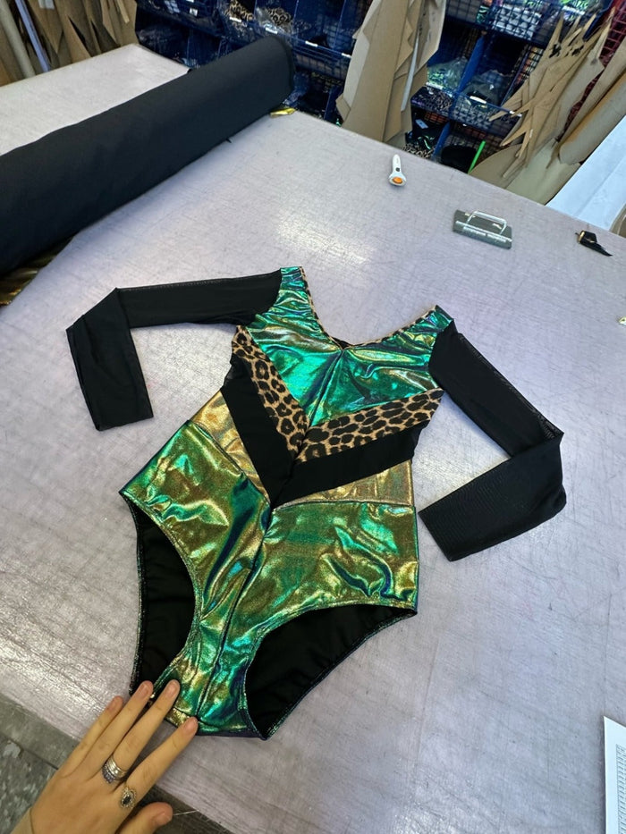 metallic green bodysuit with black sleeves
