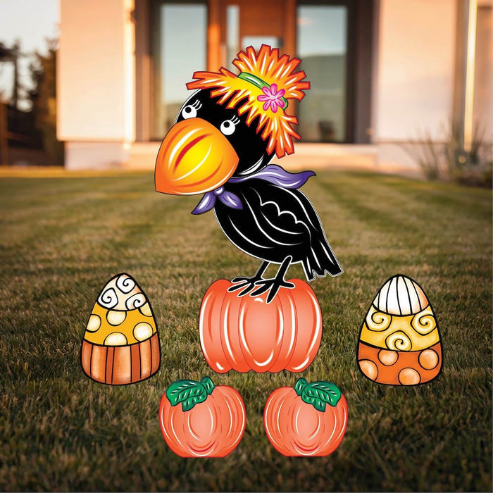 Halloween themed yard sign featuring a black crow with a flower bonnet perched on a pumpkin, surrounded by two candy corns and additional pumpkins.