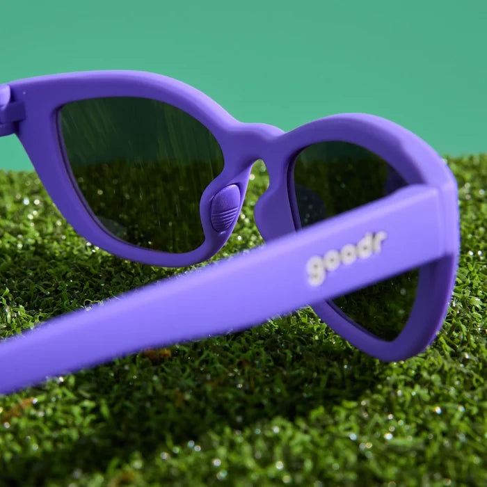 Deep purple sunglasses with a cat-eye shape. Purple reflective lenses.