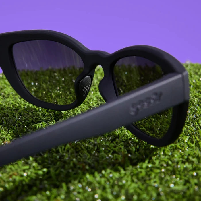 Black sunglasses with dark, gradient lenses. Simple and stylish cat-eye frames.
