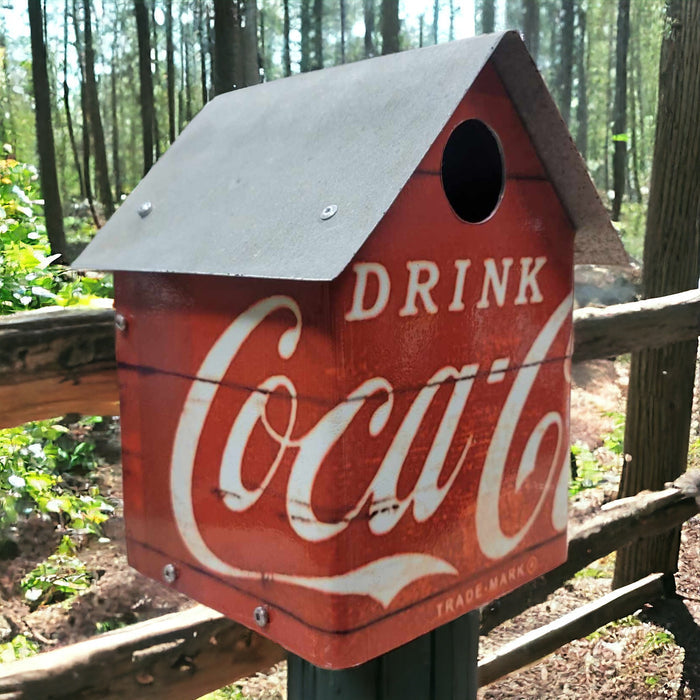 Handcrafted Coca-Cola birdhouse with reclaimed wood, galvanized roof, and Drink Coca-Cola metal walls.