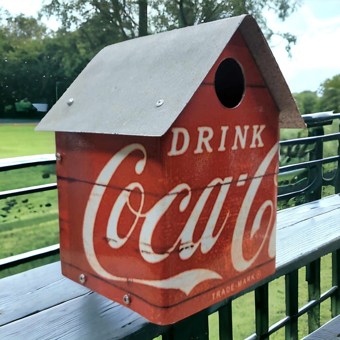 Handcrafted Coca-Cola birdhouse with reclaimed wood, galvanized roof, and Drink Coca-Cola metal walls.