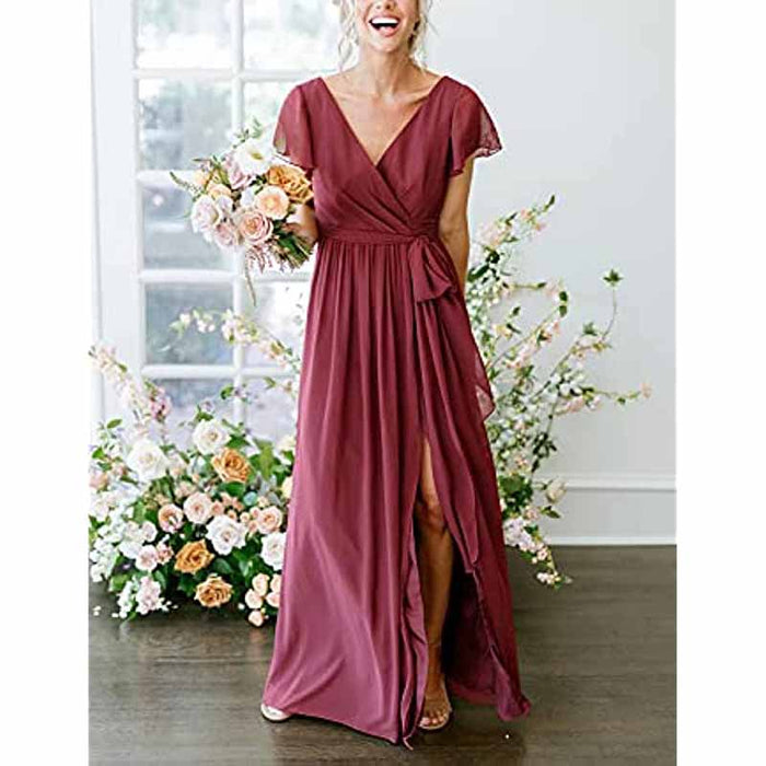 Elegant rustic wedding bridesmaid dress in burgundy with a flowing silhouette and a front slit