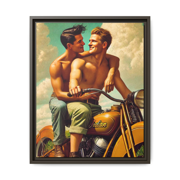 A vintage-style portrait of two young, shirtless men sitting together on a classic mustard-yellow Indian motorcycle. One man, with dark hair, sits behind the other and wraps his arm lovingly around his partner’s shoulder, gazing into his eyes. The man in front, with light hair, grips the handlebars and smiles back at him. Both wear rolled-up pants and sturdy boots. The background features a bright, partly cloudy sky, evoking a sense of freedom, warmth, and queer joy in mid-20th Century