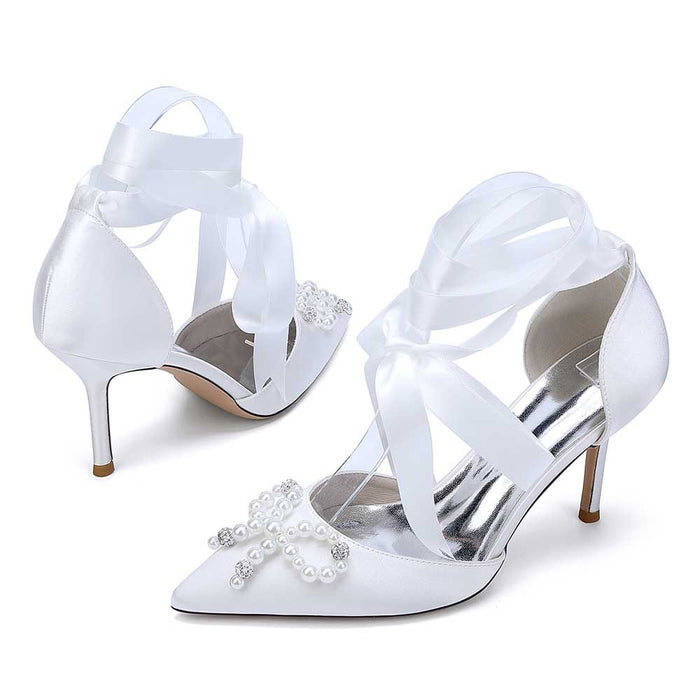 S&DCo. Pearl bow bridal heels with elegant satin finish and ankle ribbons for weddings