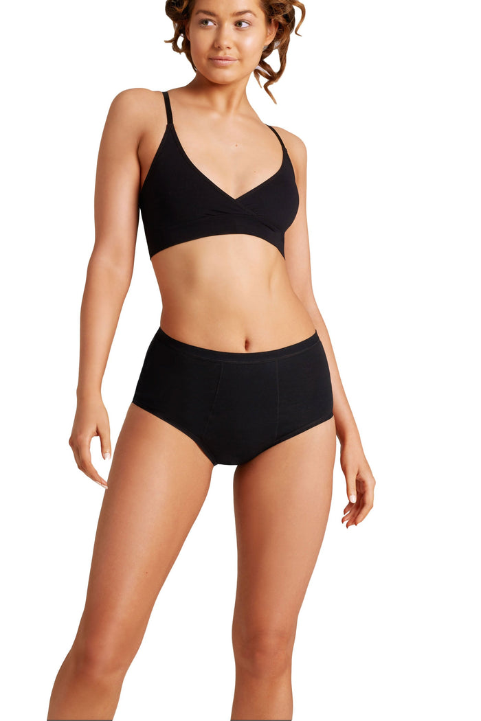 Woman wearing a love luna period full brief  on a white background