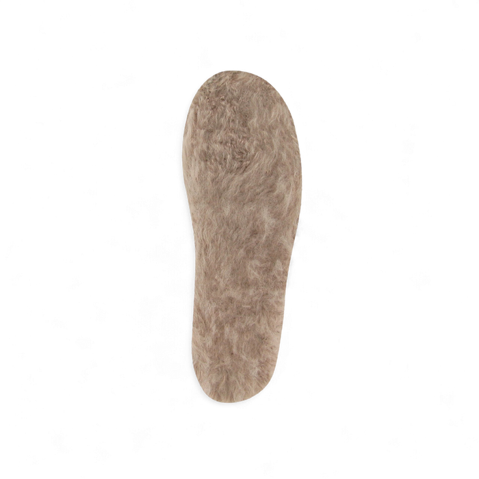 A fuzzy, tan fleece shoe insole.