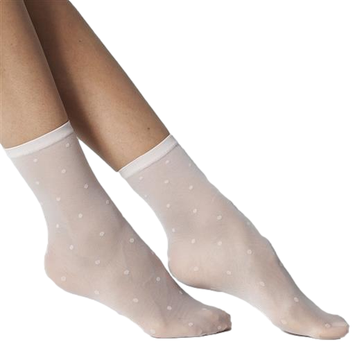 Nude coloured  socks with white polka dots worn by a model on a white background