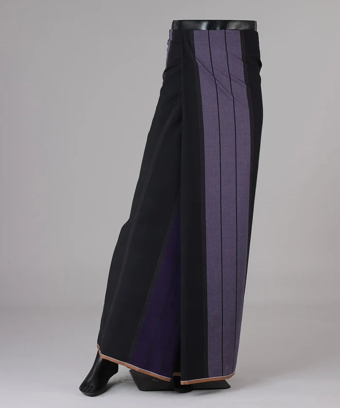 Black and purple pleated skirt on a gray background lungi