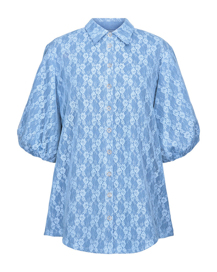 Blue floral lace blouse on a white background