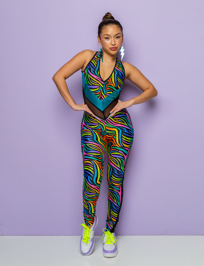 Woman modelling a multi coloured zebra print catsuit.