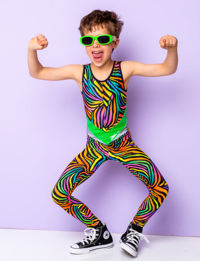 Boy modelling a multi coloured zebra print lycra catsuit and lime green sunglasses.