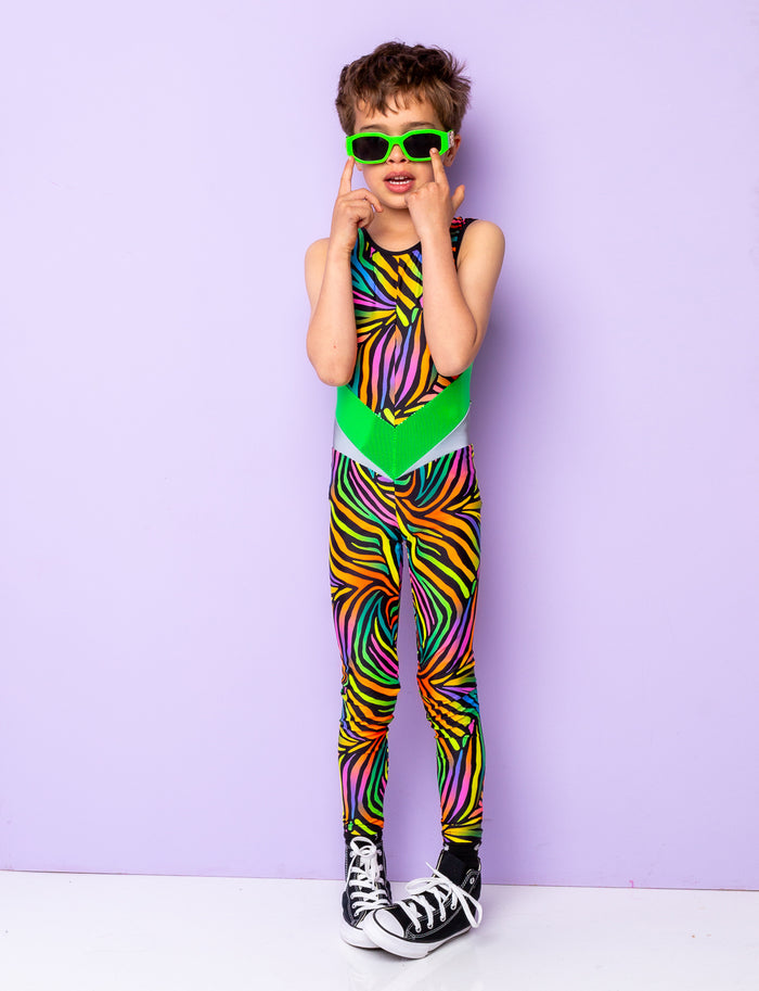 Boy modelling a multi coloured zebra print lycra catsuit and lime green sunglasses.