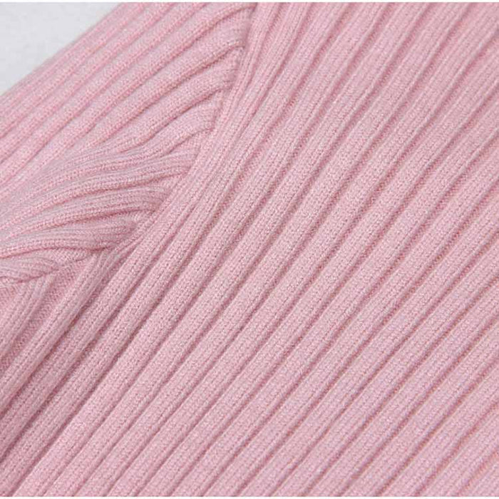 Close-up of a ribbed knit midi dress in soft pink fabric for a stylish and comfortable look