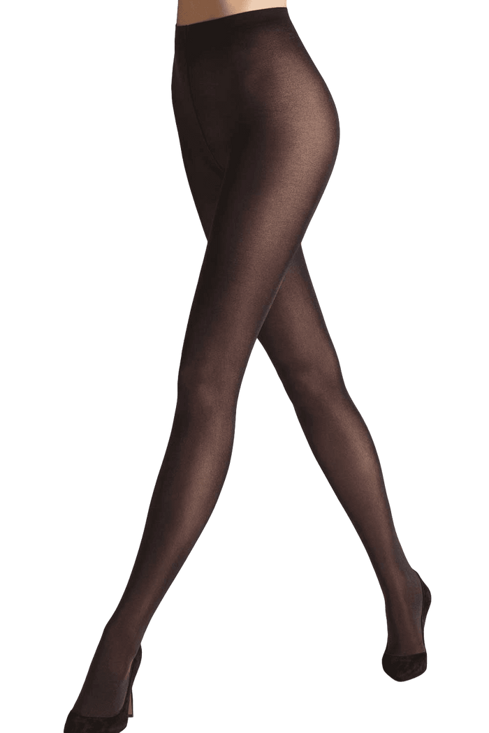 Wolford opaque  tights worn by a model on a black/grey background