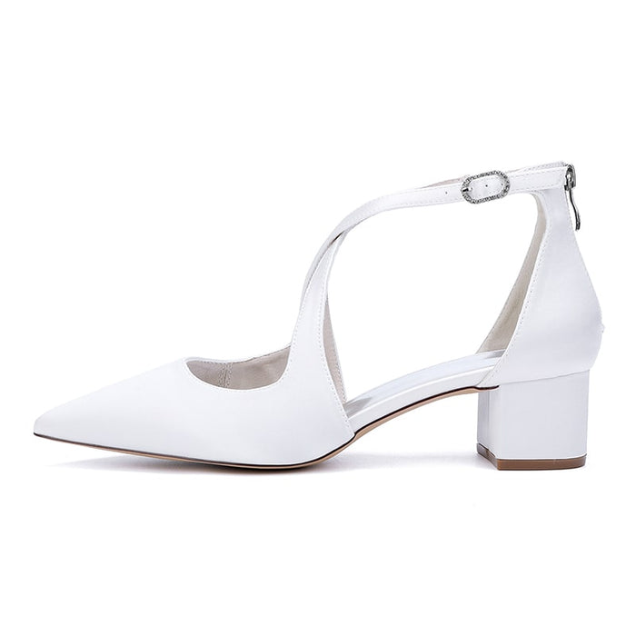 Elegant white bridal heels with crossing straps and block heel for comfort and style