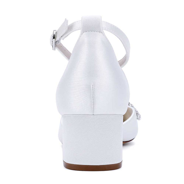Elegant white heels with an ankle strap, featuring pearl embellished bride shoes for a stylish wedding look