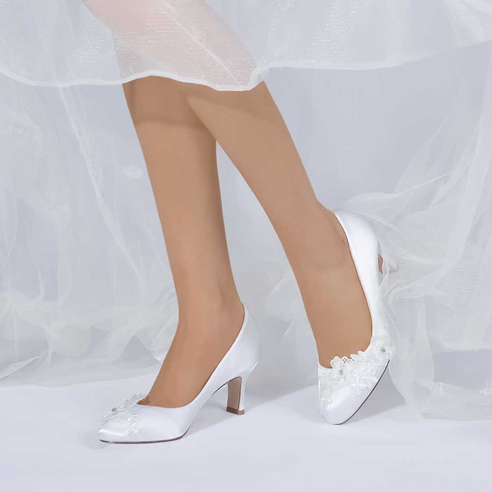 S&DCo. elegant white wedding shoes for bride low heel with floral embellishments for a classic look